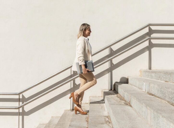 full-shot-woman-climbing-up-stairs